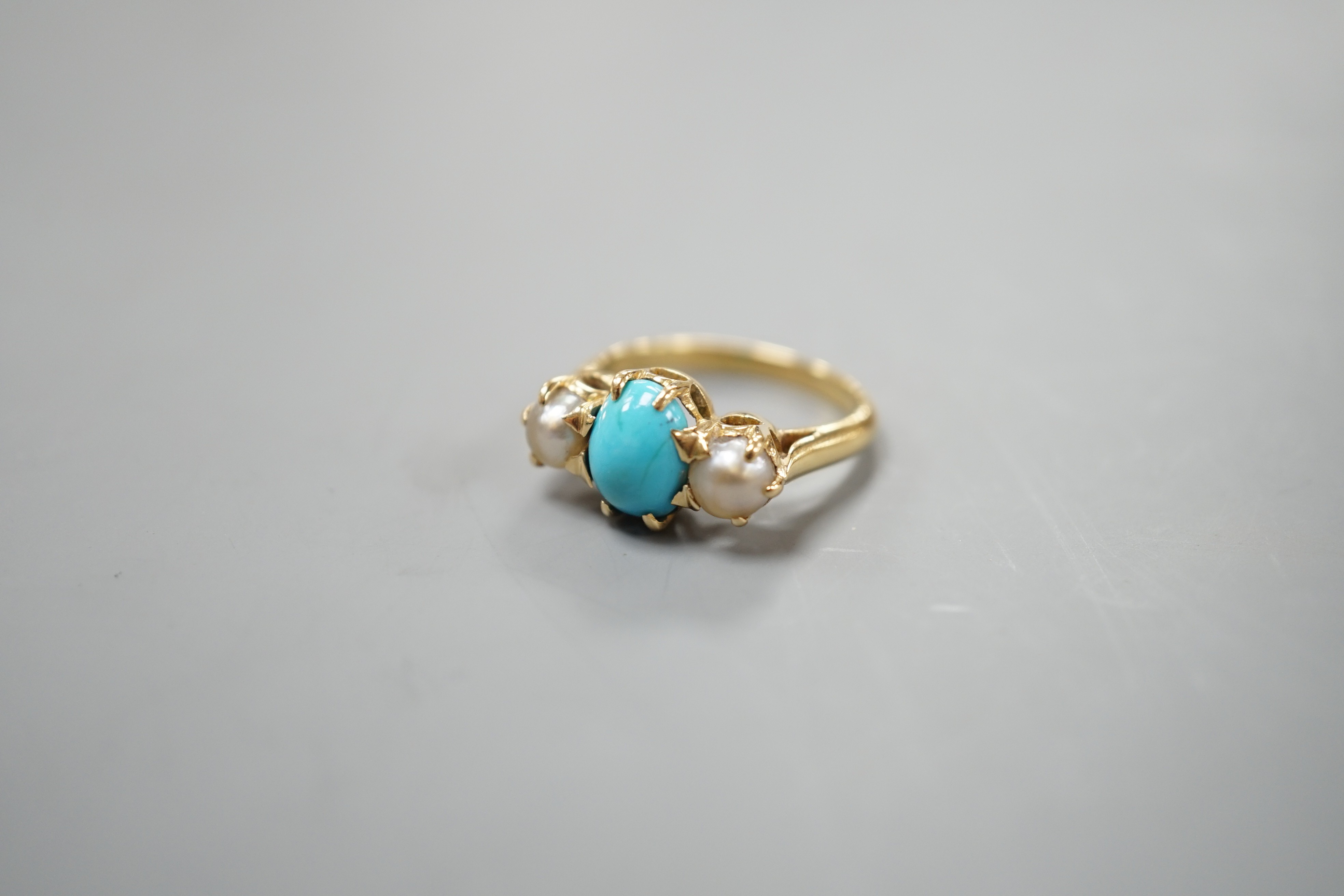 A yellow metal, turquoise and split pearl set three stone ring, size L, gross weight 4.8 grams.